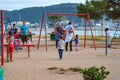 Children play in sunny summer city park on the seafront Royalty Free Stock Photo